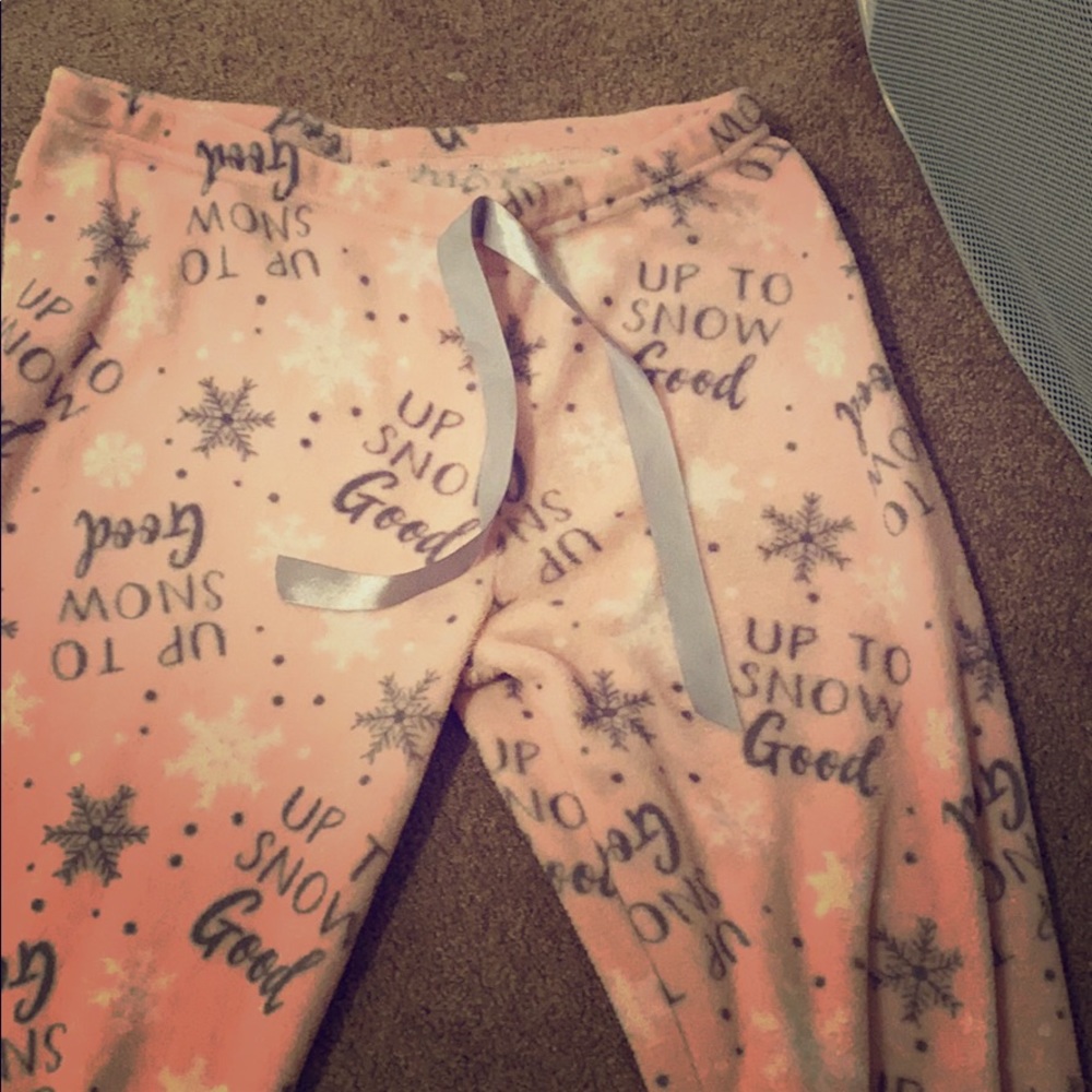 Pajama pants with a quote all over them